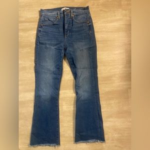 Loft medium wash, high waisted flared crop jean with bottom detail